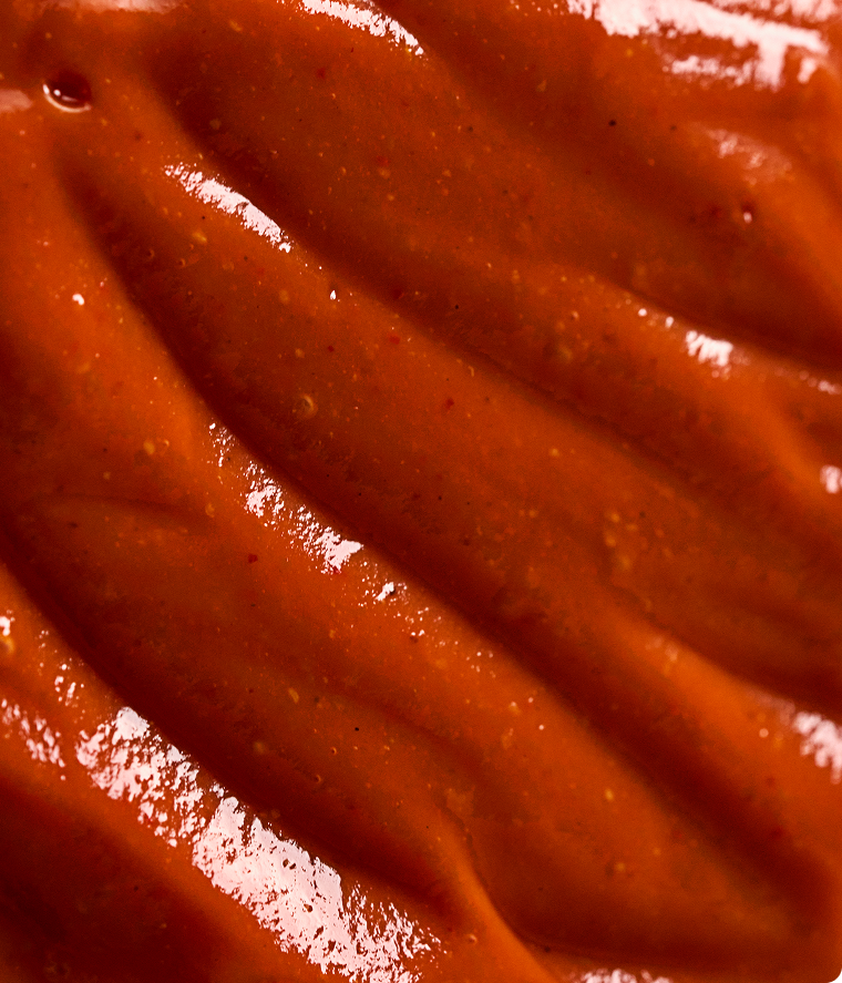 Close-up of smooth, red-brown chocolate surface