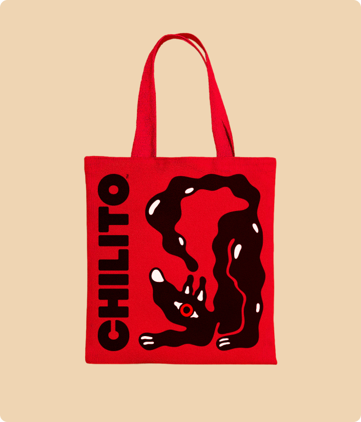 Red tote bag with black graphic design and 'CHILITO' text on a beige background